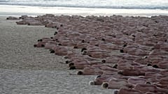 Hundreds of nude people pose for artist and photographer Spencer Tunick on Bondi Beach in Sydney, Saturday, Nov. 26, 2022. 
