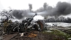 A large military gun is fired in Ukraine, November 2022. 