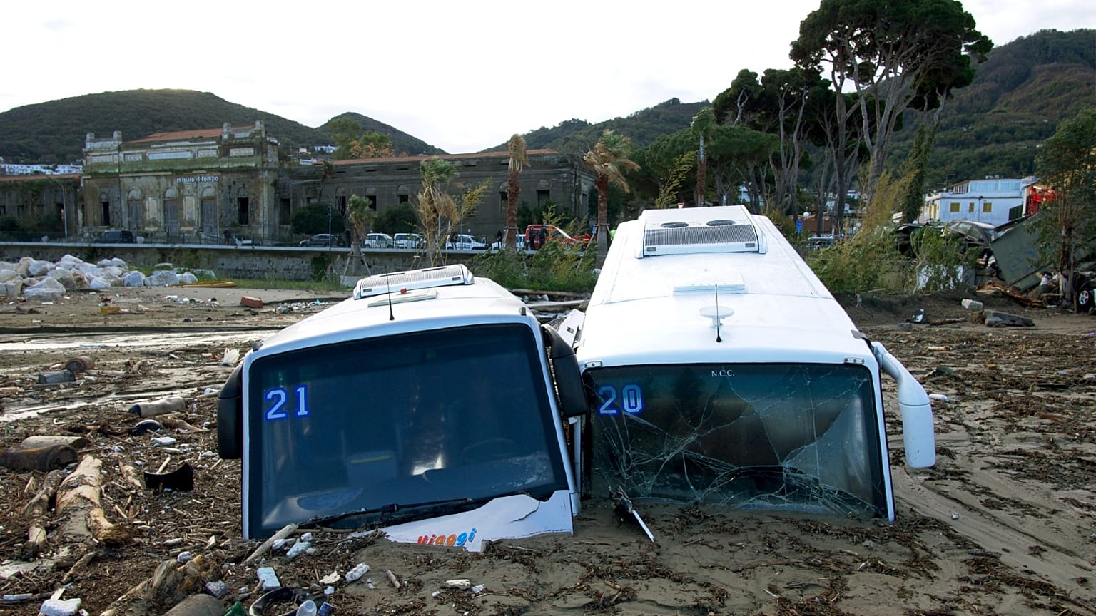 Damaged tourist busess are seen on the port of Casamicciola on November 27, 2022