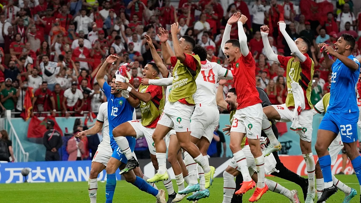 Morocco players celebrate after the World Cup group F soccer match between Belgium and Morocco, at the Al Thumama Stadium in Doha, Qatar, Sunday, Nov. 27, 2022.