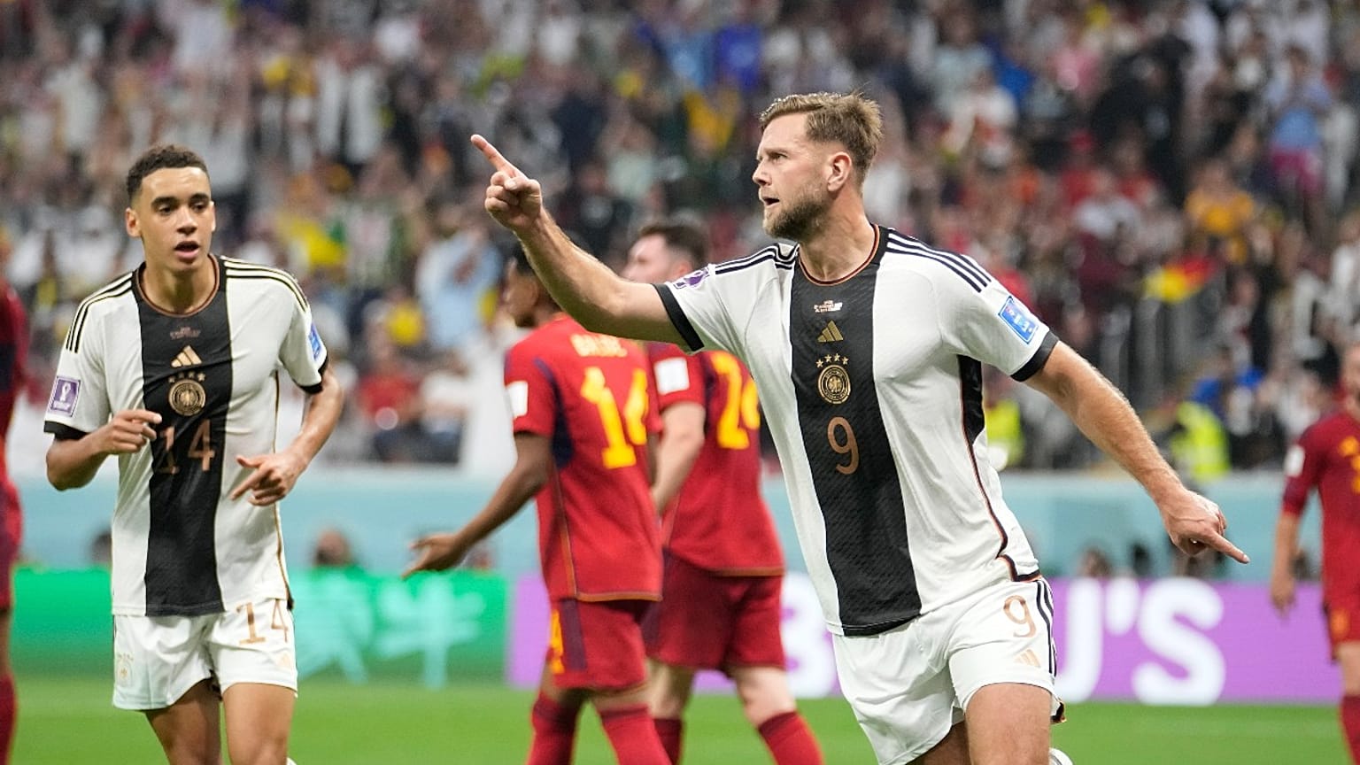Germany's Niclas Füllkrug celebrates after he scored his side's equaliser in the 1-1 draw with Spain, at the Al Bayt Stadium in Al Khor , Qatar, Sunday, Nov. 27, 2022.