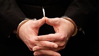 Handcuffed prisoner