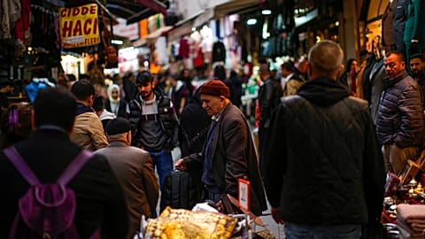 A street vendor sells hand bags in a street market in Eminonu commercial district in Istanbul, Turkey, Monday, Nov. 7, 2022. 