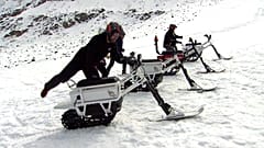 Testers mount the new French-made 'moonbike', an all-eclectric snowbike. 