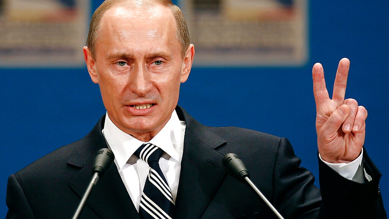 Russian President Vladimir Putin gestures as he addresses the media during a press conference on the third day of the NATO Summit conference in Bucharest, Friday April 4 2008.