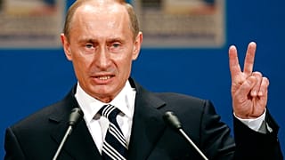 Russian President Vladimir Putin gestures as he addresses the media during a press conference on the third day of the NATO Summit conference in Bucharest, Friday April 4 2008.