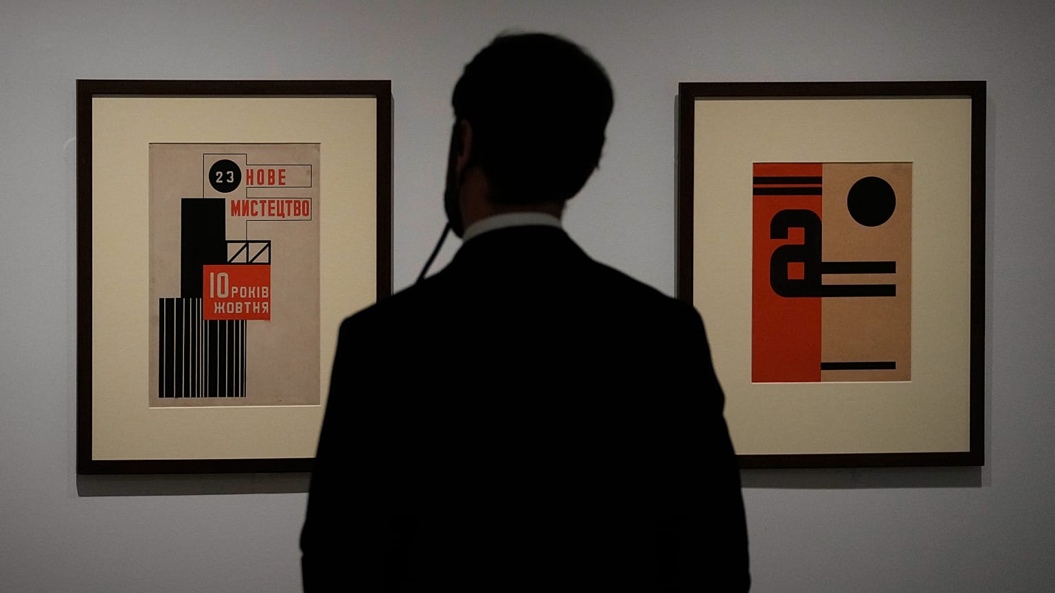 A man looks at artwork by Ukrainian artist Vasyl Yermilov called 'Nove Mystetstvo' during the inauguration of the Ukraine art exposition at the Thyssen-Bornemisza museum.