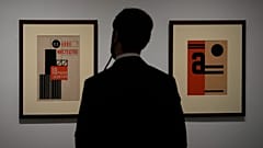 A man looks at artwork by Ukrainian artist Vasyl Yermilov called 'Nove Mystetstvo' during the inauguration of the Ukraine art exposition at the Thyssen-Bornemisza museum.