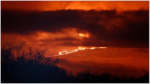A river of lava flows down from Mauna Loa, near Hilo, Hawaii.