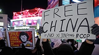 Demonstrators stage a rally to denounce Chinese government's continued zero-COVID policies in Seoul, South Korea.