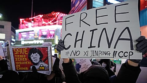 Demonstrators stage a rally to denounce Chinese government's continued zero-COVID policies in Seoul, South Korea.