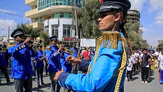 A police marching band plays at a street carnival organized by the Tigray Development Association in support of the recent peace deal agreed between the Ethiopian federal gove