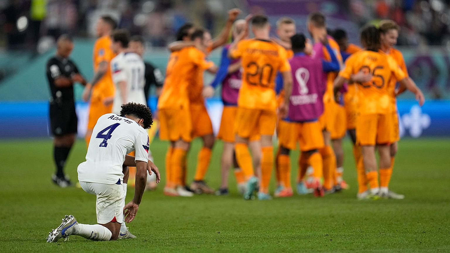 Tyler Adams of the United States knees down on the pitch at the end of the World Cup round of 16 match agains the Netherlands in Doha, 3 December 2022