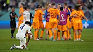 Tyler Adams of the United States knees down on the pitch at the end of the World Cup round of 16 match agains the Netherlands in Doha, 3 December 2022