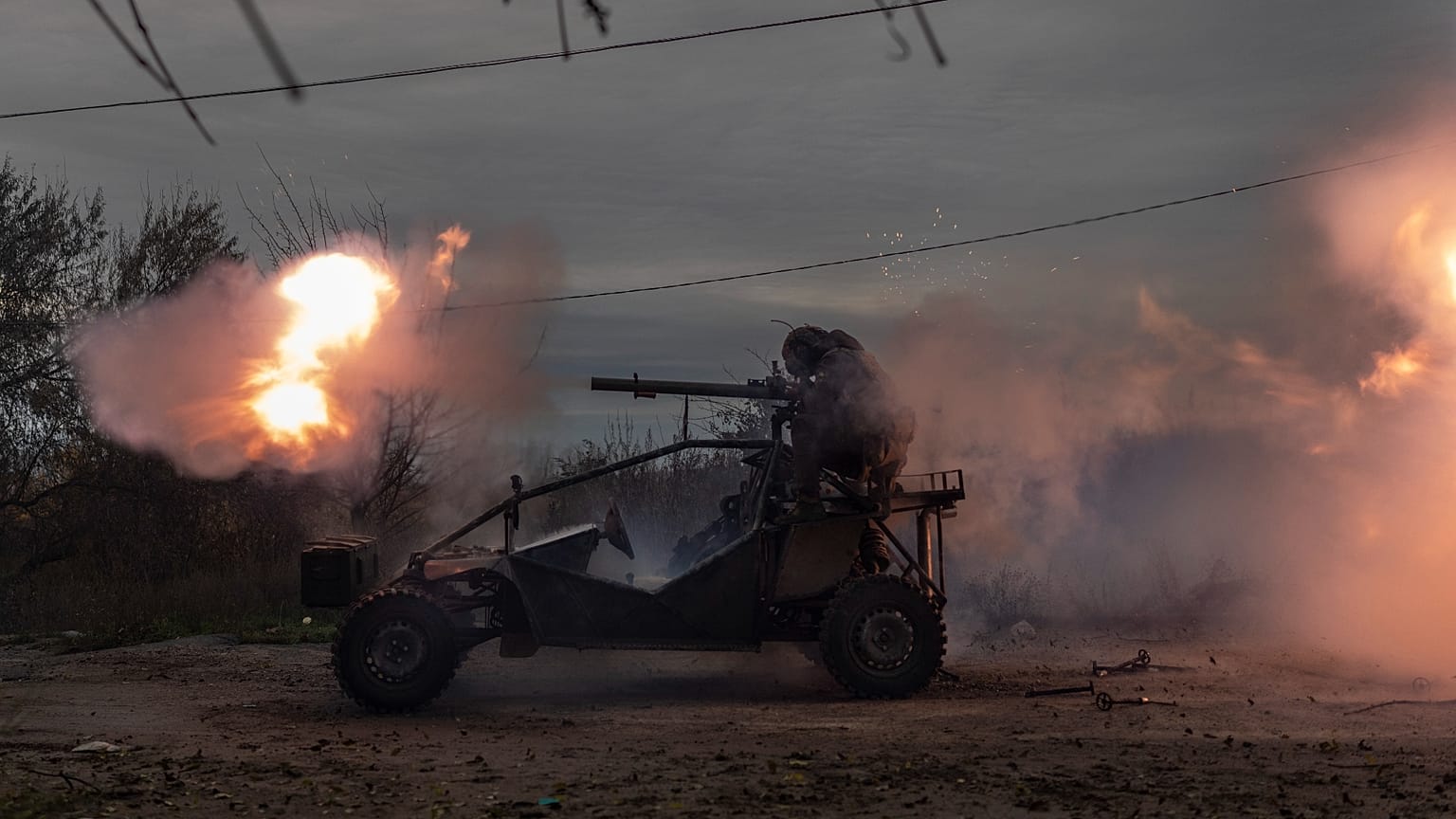 Ukrainian servicemen fire toward Russian positions in the frontline near Kherson, southern Ukraine.