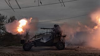 Ukrainian servicemen fire toward Russian positions in the frontline near Kherson, southern Ukraine, Wednesday, Nov. 23, 2022