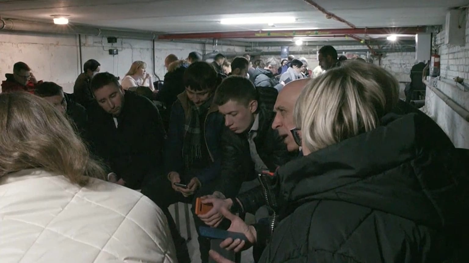 Ukrainians and UN officials in a bunker during an air raid in Kyiv