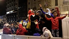 Morocco fans celebrate their team's victory against Spain in the World Cup round of 16 soccer match between Morocco and Spain, in Casablanca, Morocco, Tuesday 2022