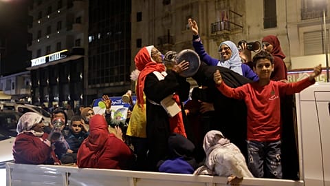 Morocco fans celebrate their team's victory against Spain in the World Cup round of 16 soccer match between Morocco and Spain, in Casablanca, Morocco, Tuesday 2022