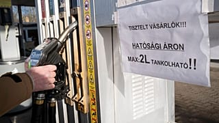 A sign on a pump in Martonvasar, Hungary, warns customers that they can only purchase 2 litres of fuel at the regulated price.