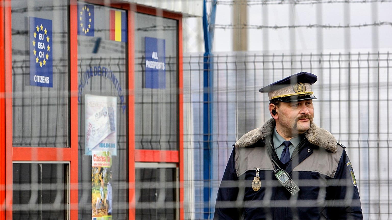  Romanian border police officer stands guard at the railway border crossing point between Romania and Moldova in Ungheni, Romania, on Jan. 18, 2011. 