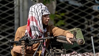 A Taliban fighter stands guard in Kabul, September 2022