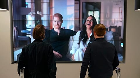 Office workers in London watch the Duke and Duchess of Sussex's controversial documentary being aired on Netflix 