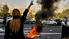 Iranians protests the death of 22-year-old Mahsa Amini after she was detained by the morality police, in Tehran, Oct. 1, 2022.