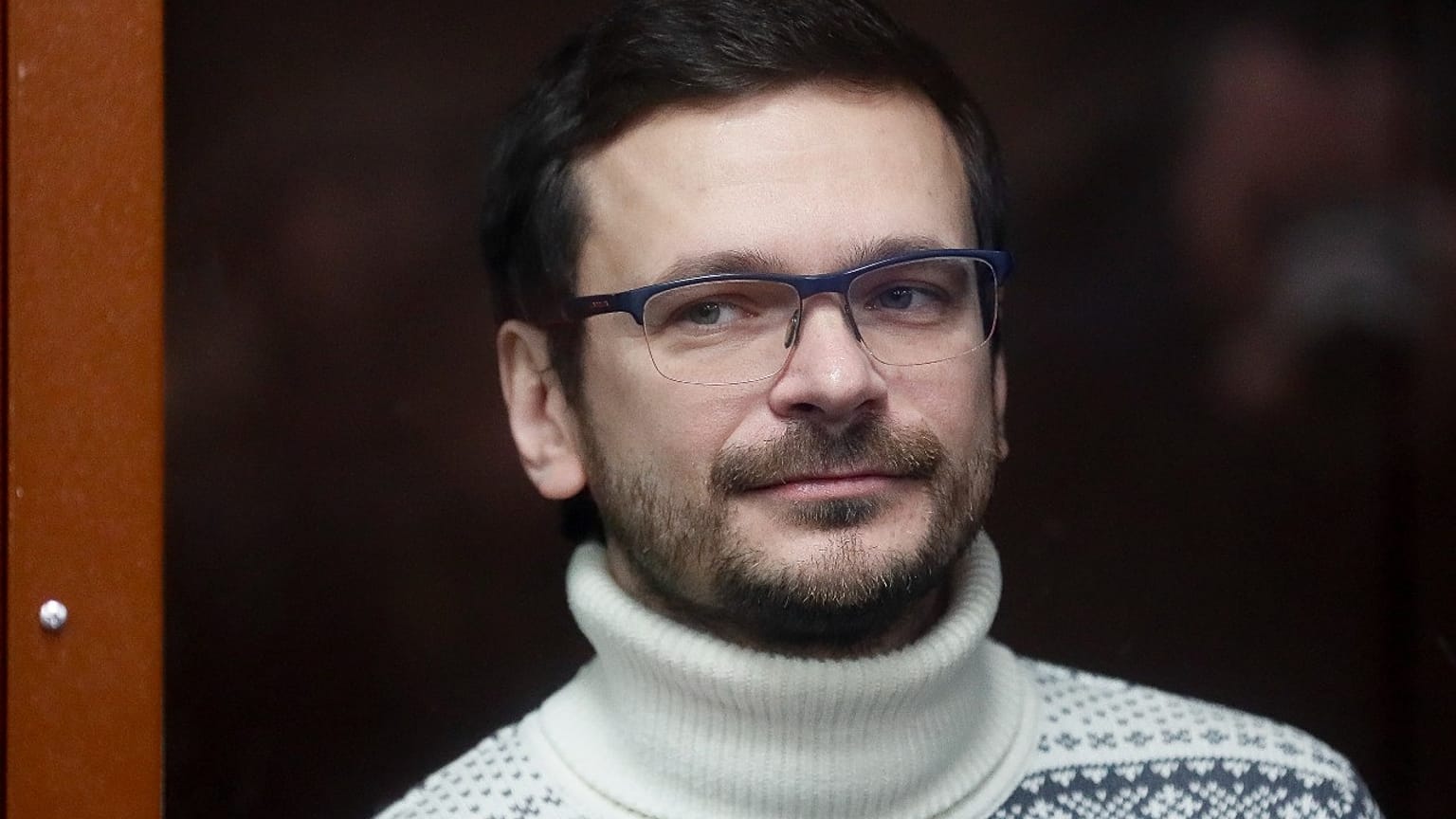 Russian opposition activist and former municipal deputy of the Krasnoselsky district Ilya Yashin inside a glass cubicle prior to a court hearing in Moscow, Dec. 9, 2022.