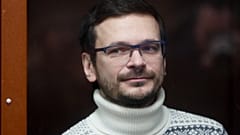 Russian opposition activist and former municipal deputy of the Krasnoselsky district Ilya Yashin inside a glass cubicle prior to a court hearing in Moscow, Dec. 9, 2022.