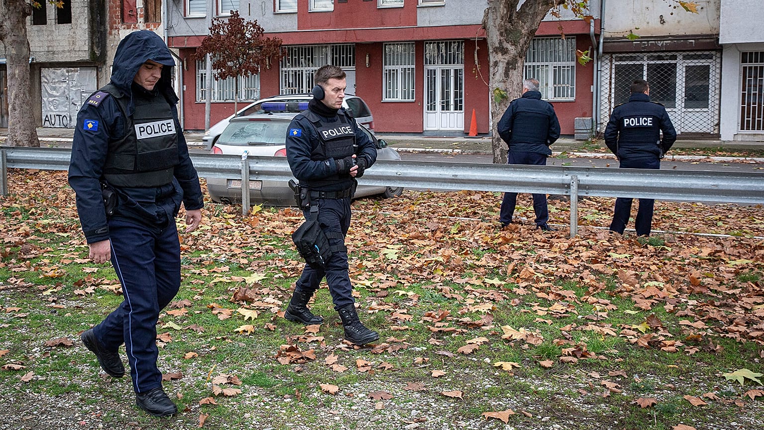 Kosovo police officers guard the offices of the Central Election Committee in ethnically divided town of northern Mitrovica, 9 December 2022