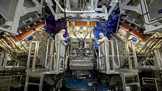 National Ignition Facility (NIF) Target Area operators inspect a final optics assembly (FOA) during a routine maintenance period at Lawrence Livermore National Laboratory.