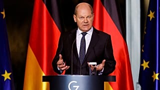 German Chancellor Olaf Scholz holds a news conference following a virtual meeting with fellow G7 leaders, in Berlin, Germany, 12 December 2022.