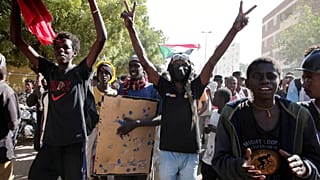 Sudanese demonstrators against military rule march in Khartoum, Sudan, Tuesday, Dec. 13, 2022