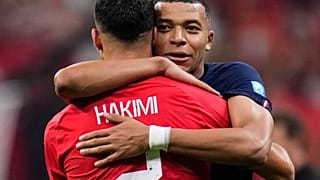 France's Kylian Mbappe hugs Morocco's Achraf Hakimi at the end of the World Cup semi-final in Qatar.