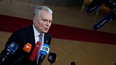 Lithuania's President Gitanas Nauseda speaks with the media as he arrives for an EU summit in Brussels, Dec. 15, 2022.