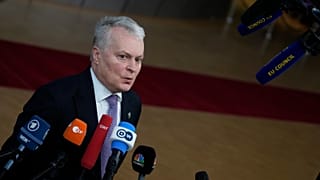 Lithuania's President Gitanas Nauseda speaks with the media as he arrives for an EU summit in Brussels, Dec. 15, 2022.