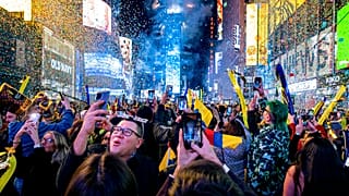 FILE — Revelers celebrate in Times Square in New York, Jan. 1, 2022, as they attend New Year's Eve celebrations. 