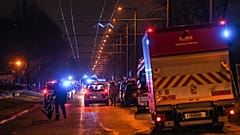 Firefighters and rescuers work in a building of the Mas-Du-Taureau quarter where a fire caused many victims, including children, on December 16, 2022 in Vaulx-en-Velin.