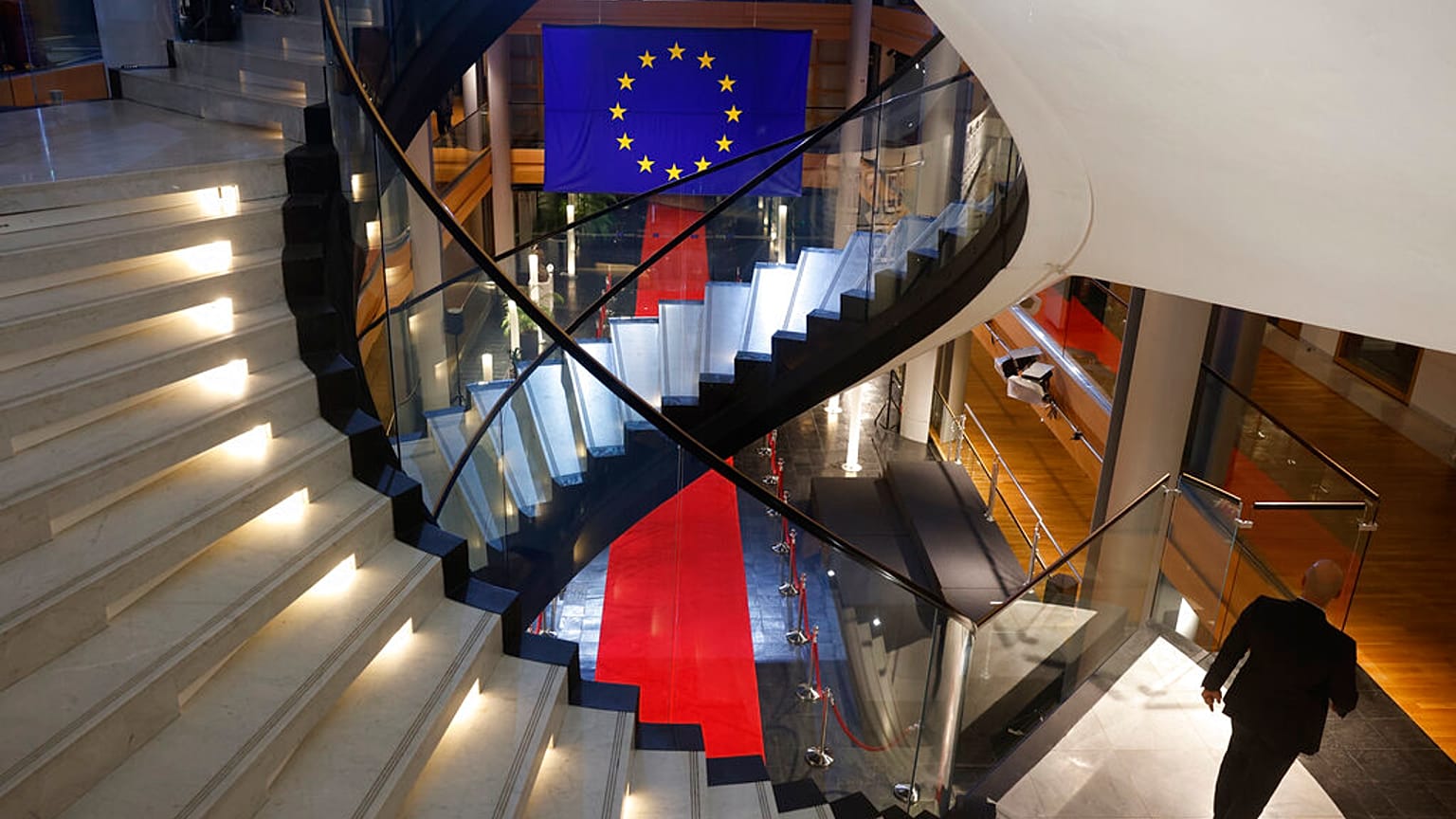 FILE - A man walks down stairs during a special session on lobbying at the European Parliament in Strasbourg, eastern France, Dec. 12, 2022. 
