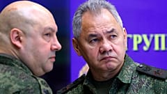 Russia's top military commander in Ukraine, Gen. Sergei Surovikin, left, and Russian Defence Minister Sergei Shoigu attend a meeting with Russian President Vladimir Putin 