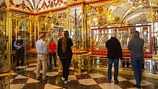 FILE - Visitors stand in the Jewel Room during the reopening of the Green Vault Museum in Dresden's Royal Palace of the Dresden State Art Collections (SKD) in Dresden, Germany
