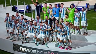Argentina's squad celebrate after their World Cup final victory against France at the Lusail Stadium in Lusail, Qatar, Sunday, Dec. 18, 2022. 