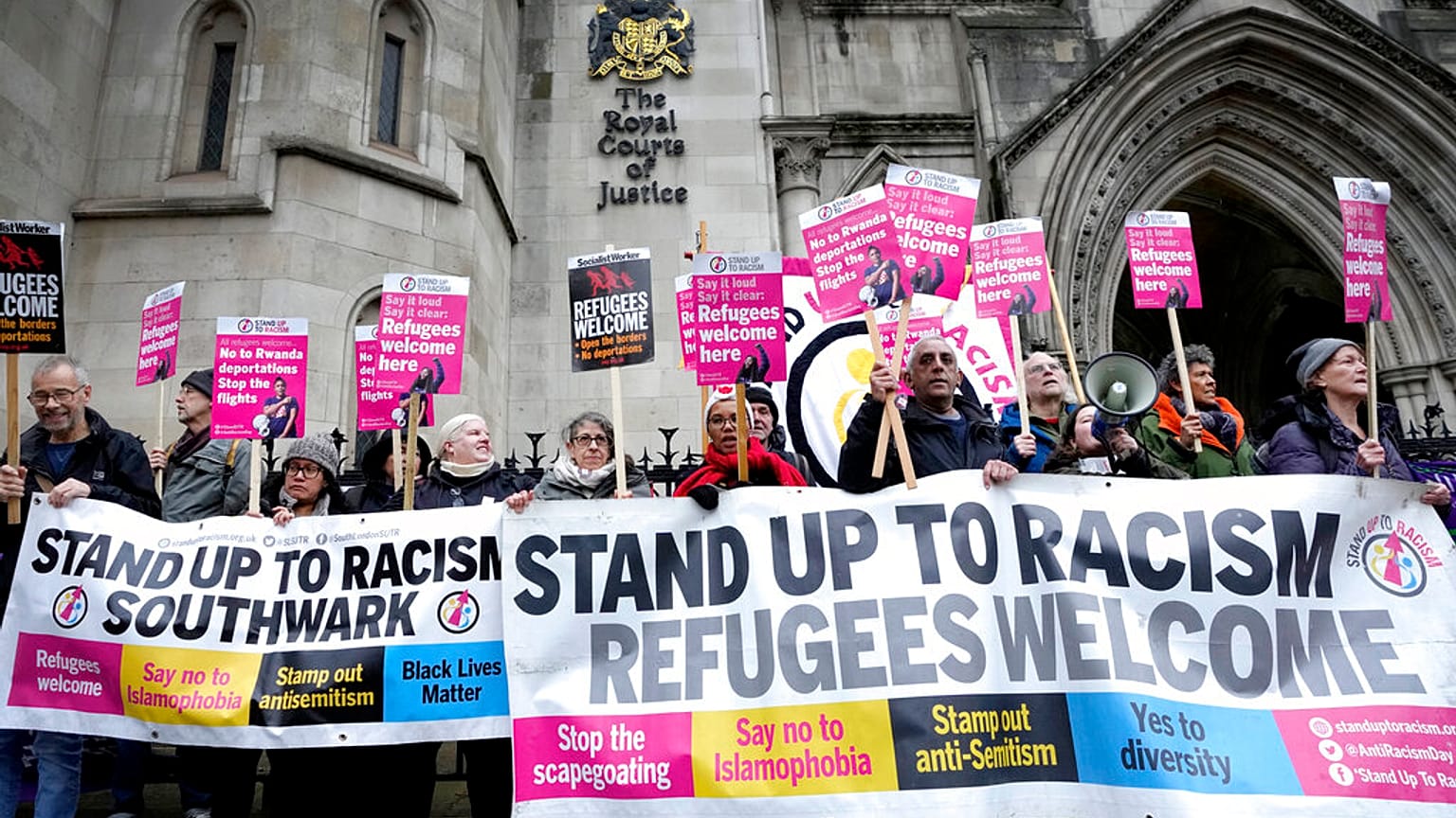 Protesters gathered outside the court in London