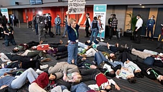 Members of the Global Youth Biodiversity Network demonstrate in the halls of the COP15 convention centre