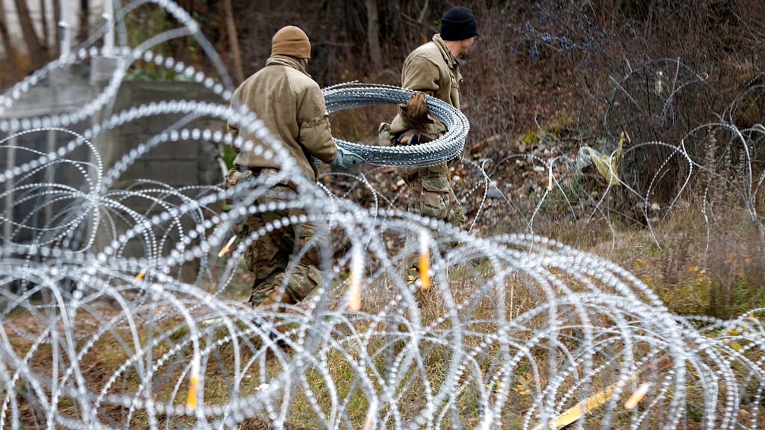 US soldiers serving in NATO-led peacekeeping force KFOR, place a barbed wire at a checkpoint near the northern Kosovo border crossing Sunday, Dec. 18, 2022.
