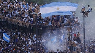 Argentina World Cup champions are welcomed home by thousands of residents.
