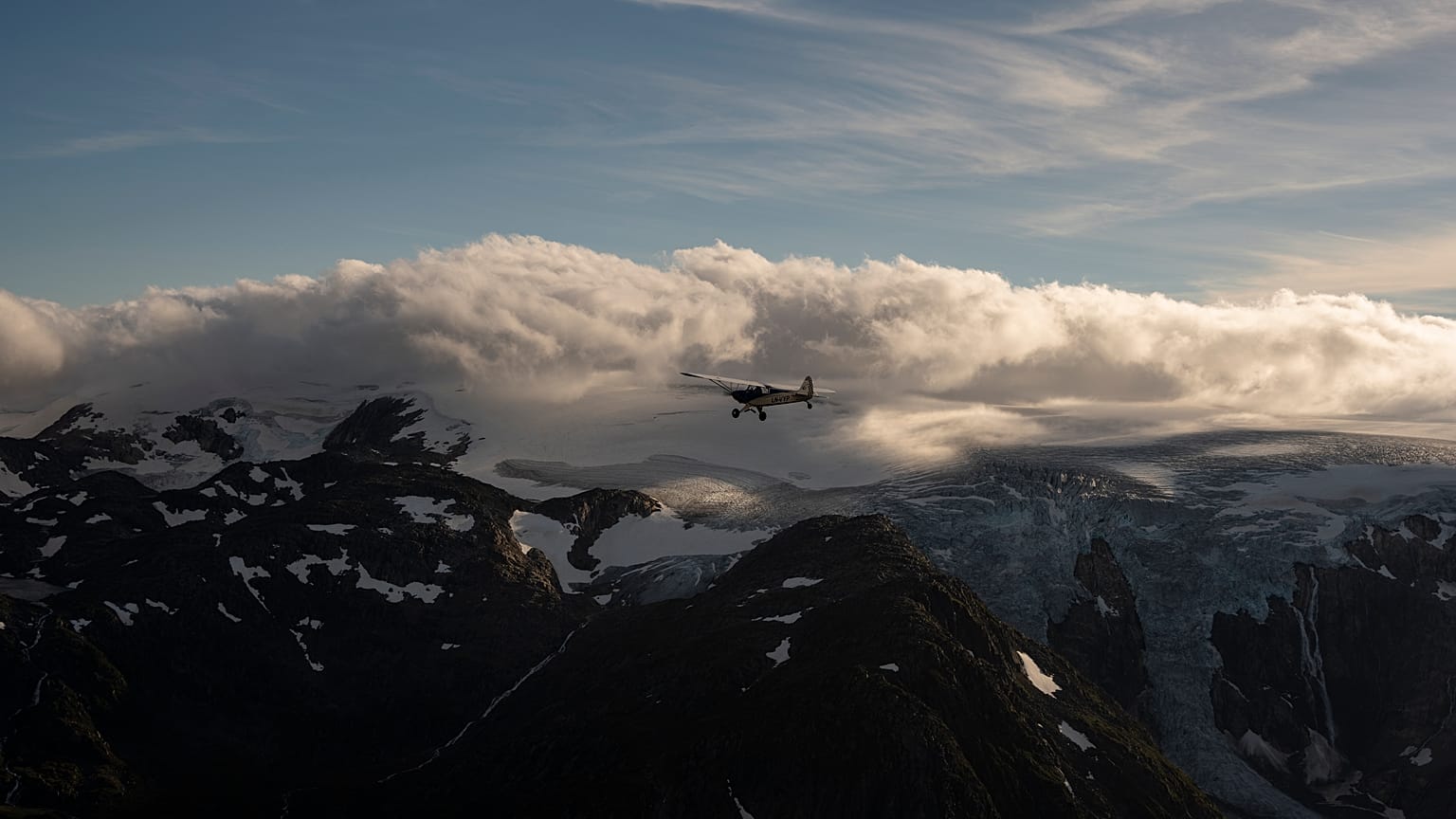 Aviator and adventurer Garrett Fisher flies his plane above the Folgefonna glacier in Norway.