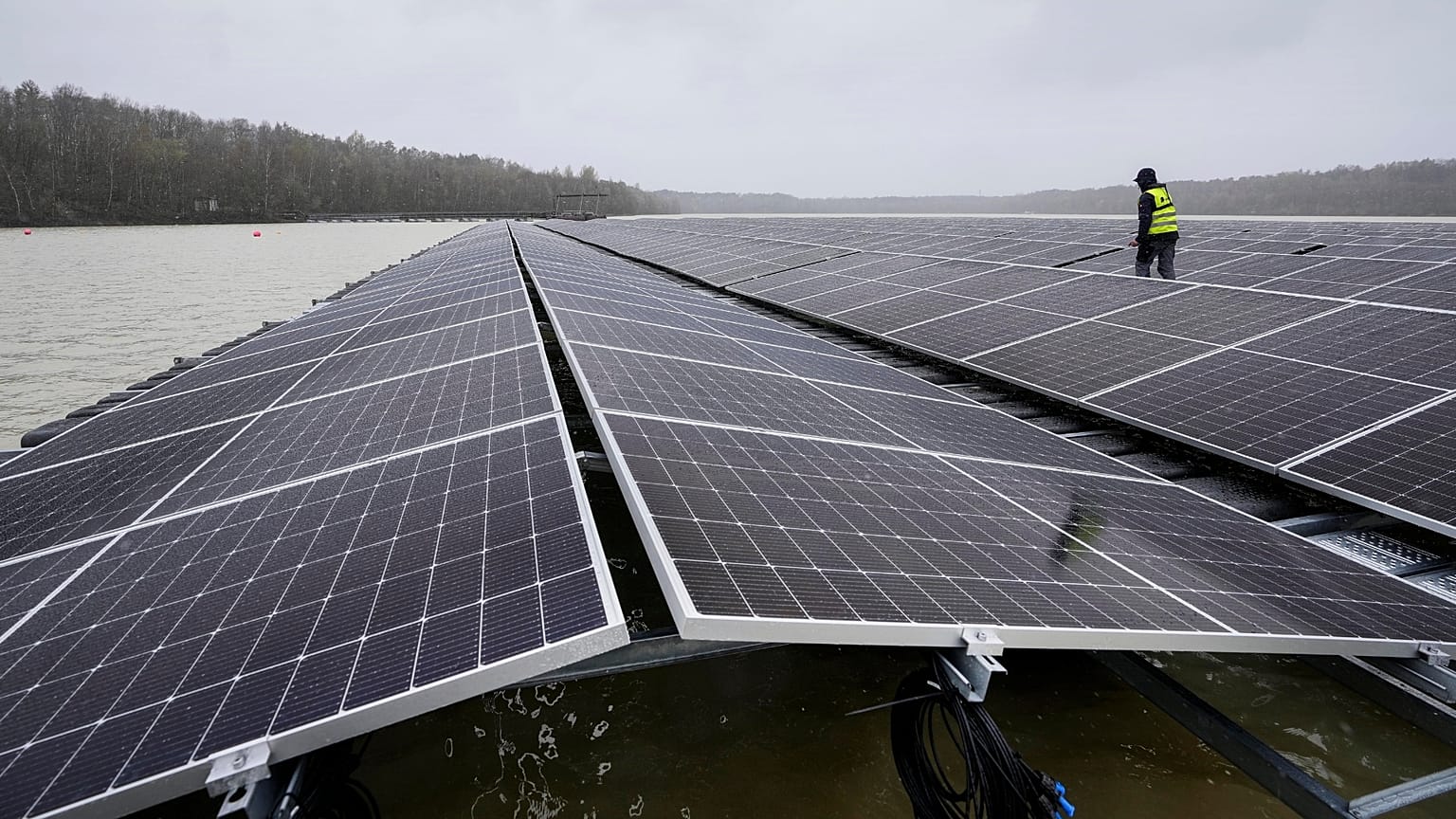 Solar panels are installed at a floating photovoltaic plant on a lake in Haltern.