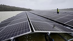 Solar panels are installed at a floating photovoltaic plant on a lake in Haltern.